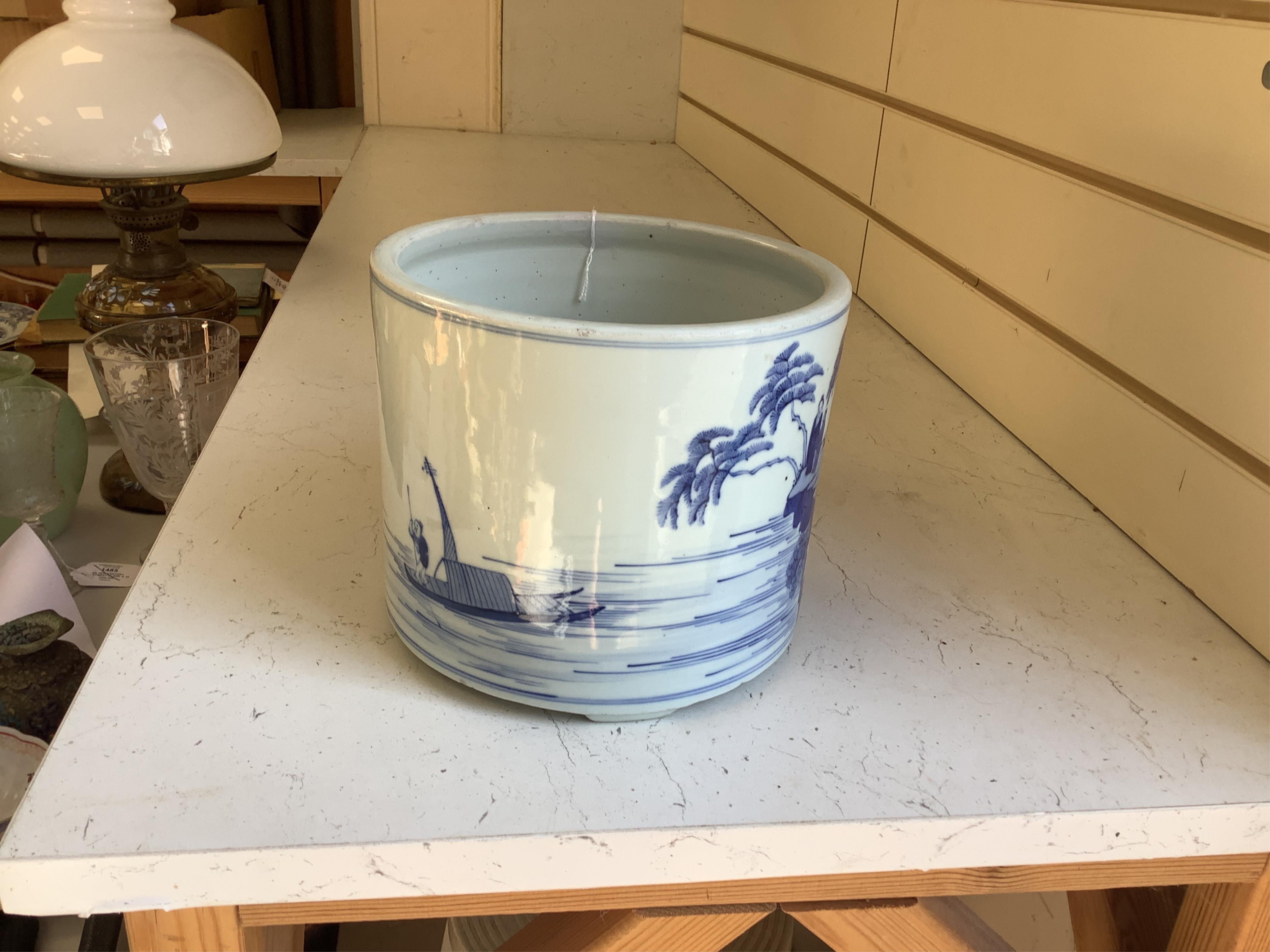 A Chinese blue and white brushpot, 17cm high. Condition - good